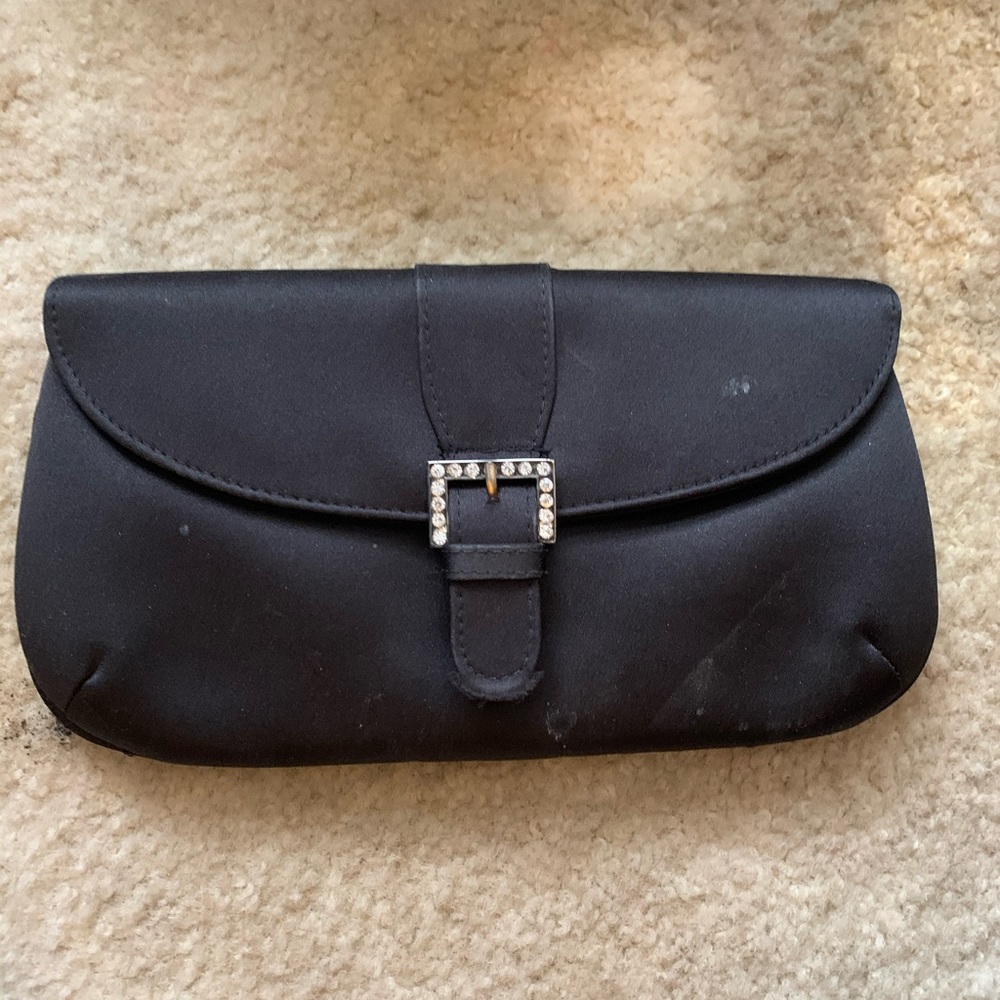 Black clutch with a sparkly button